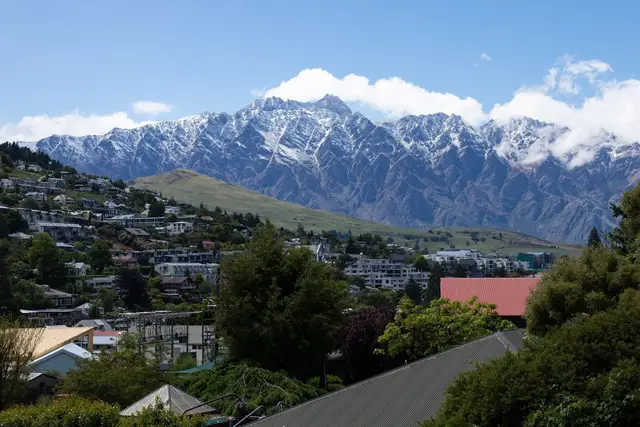 Lake Wakatipu and Queenstown in the foreground, with the Remarkables rising across the water.